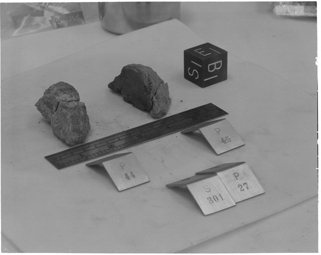 Black and white photograph of Apollo 14 Sample(s) 14301,27,44,45; Processing photograph displaying a reconstruction with an orientation of E,S,B.