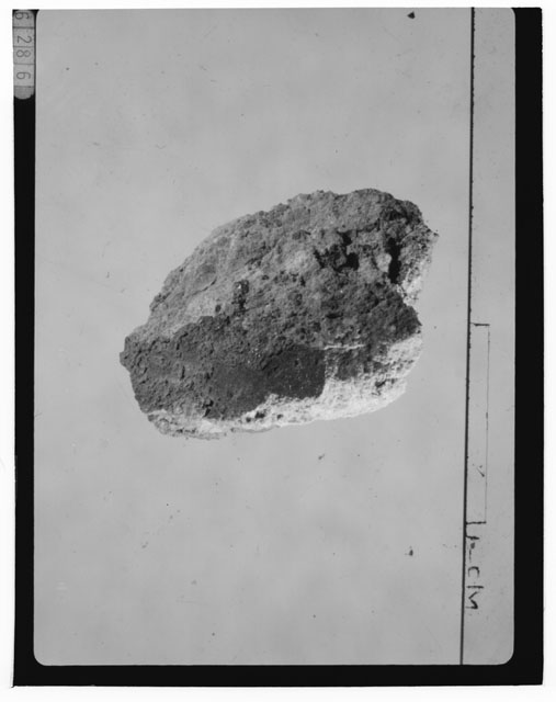 Black and white photograph of Apollo 14 Sample(s) 14301,53; Processing photograph displaying a chip.