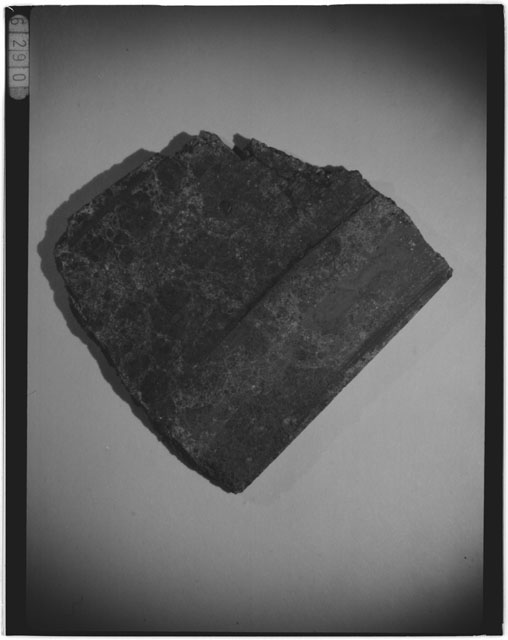Black and white photograph of Apollo 14 Sample(s) 14305,46; Processing photograph displaying a chip.