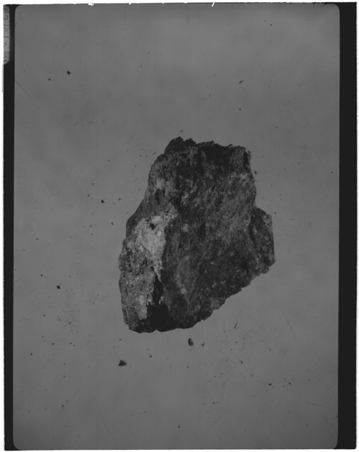 Black and white photograph of Apollo 14 Sample(s) 14306,41; Processing photograph displaying a chip.