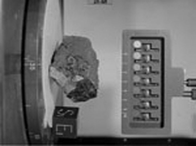 Black and White Photograph of Apollo 15 Sample(s) 15205, 0; Stereo photo with orientation 135 degrees, A.