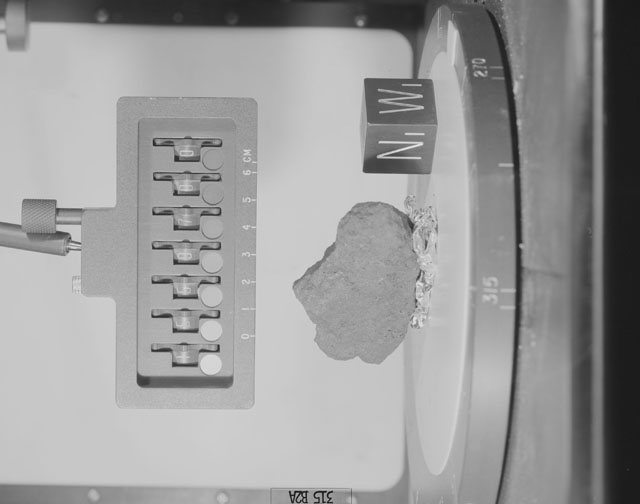 Black and White Photograph of Apollo 15 Sample(s) 15597, 0; Stereo photo with orientation 315 degrees, A.