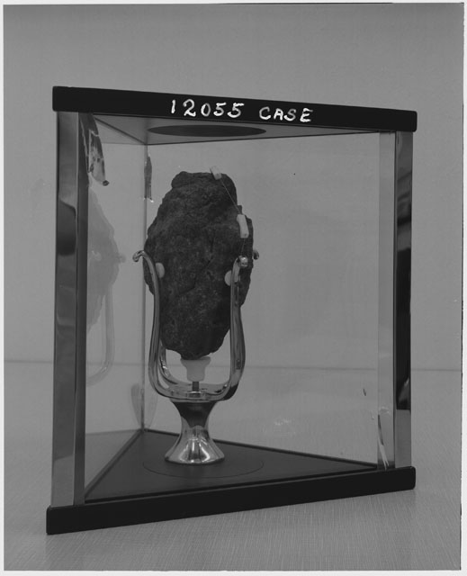 Black and white photograph of Apollo 12 sample 12055,32 in display case.