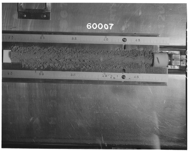 Black and white photograph of Apollo 16 Sample(s) 60007; Processing photograph displaying Core Tube at 24-48 cm depth.