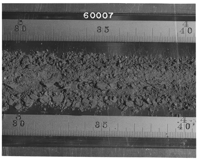 Black and white photograph of Apollo 16 Sample(s) 60007; Processing photograph displaying Core Tube at 30-40 cm depth.