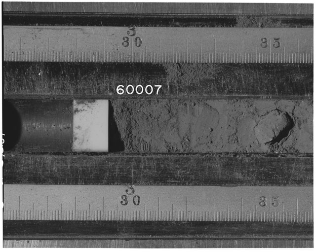 Black and white photograph of Apollo 16 Sample(s) 60007; Processing photograph displaying Core Tube at 25.5-36.5 cm depth.
