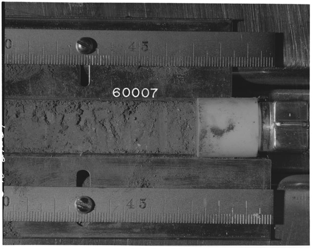 Black and white photograph of Apollo 16 Sample(s) 60007; Processing photograph displaying Core Tube at 40.5-48 cm depth.