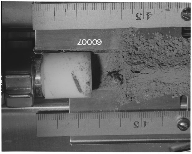 Black and white photograph of Apollo 16 Sample(s) 60007; Processing photograph displaying Core Tube at 43-48 cm depth.