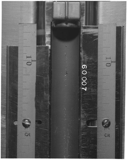 Black and white photograph of Apollo 16 Sample(s) 60007; Processing photograph displaying Core Tube at 7.5-16.5 cm depth.