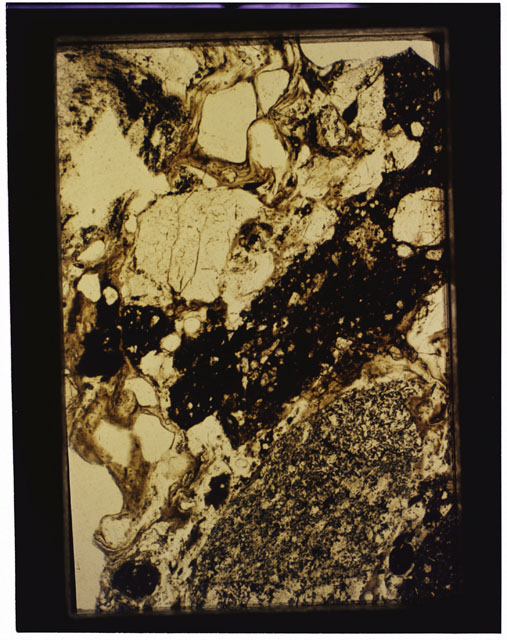 Color photograph of Apollo 16 Sample(s) 68115; 2.5x magnification of a Thin Section photograph using reflected light.