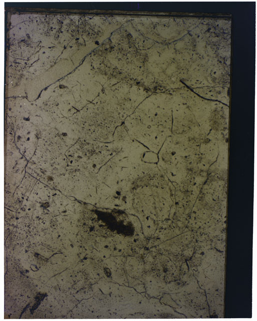 Color photograph of Apollo 16 Sample(s) 61016; 2.5x magnification of a Thin Section photograph using reflected light.