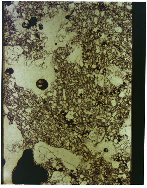 Color photograph of Apollo 16 Sample(s) 65015; 2.5x magnification of a Thin Section photograph using reflected light.