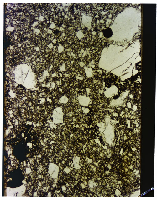 Color photograph of Apollo 16 Sample(s) 65015; 2.5x magnification of a Thin Section photograph using plane-polarized light.