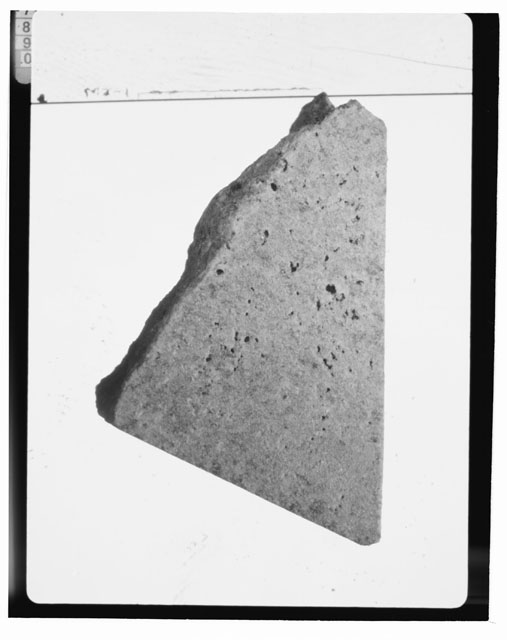 Black and white photograph of Apollo 16 Sample(s) 65015,16; Processing photograph displaying a chip.