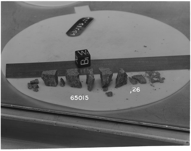 Black and white photograph of Apollo 16 Sample(s) 65015,26; Processing photograph displaying a reconstruction.