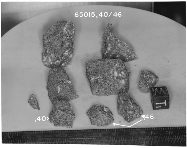Black and white photograph of Apollo 16 Sample(s) 65015,40-,46; Processing photograph displaying group reconstruction with an orientation of T,W.