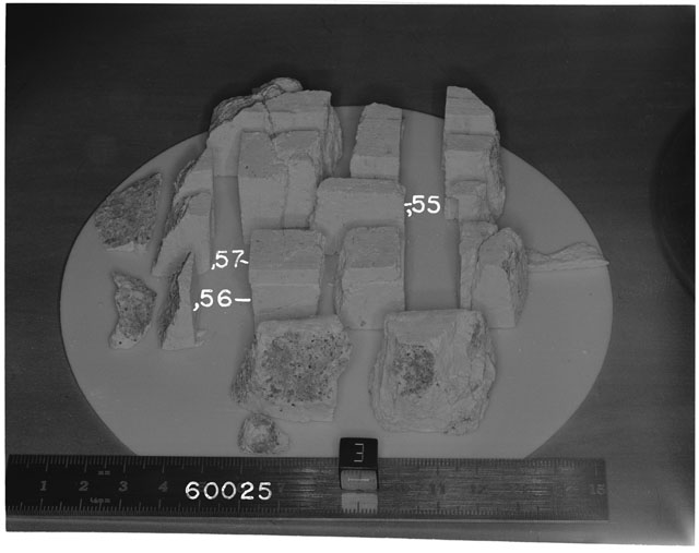 Black and white photograph of Apollo 16 Sample(s) 60025,55-57; Processing photograph displaying reconstruction with an orientation of T,E.