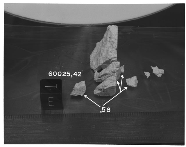Black and white photograph of Apollo 16 Sample(s) 60025,42,58; Processing photograph displaying reconstruction with an orientation of E,T.
