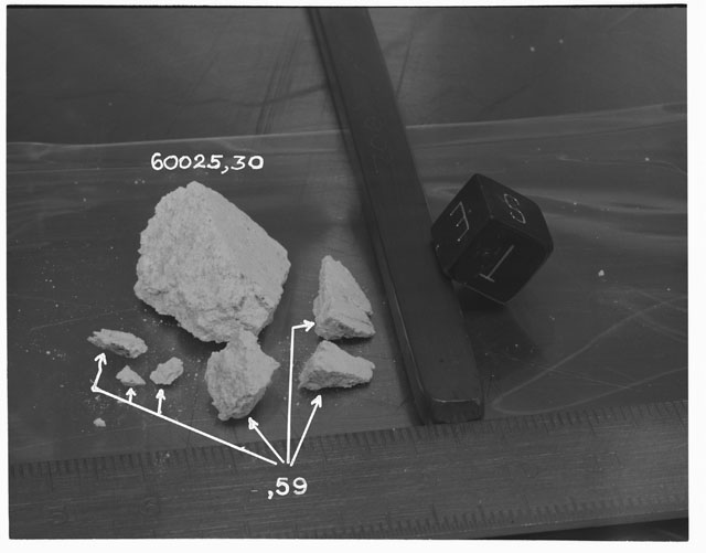 Black and white photograph of Apollo 16 Sample(s) 60025,30,59; Processing photograph displaying reconstruction with an orientation of T,S,E.