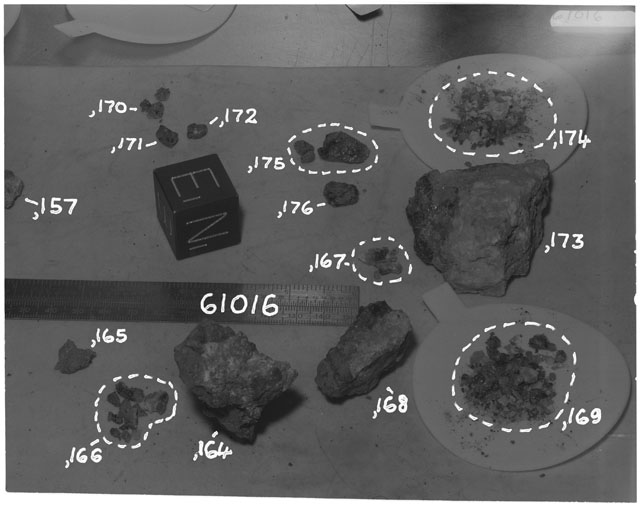 Black and white photograph of Apollo 16 Sample(s) 61016,157,164-168,170-176; Processing photograph displaying group with an orientation of N,E,B.
