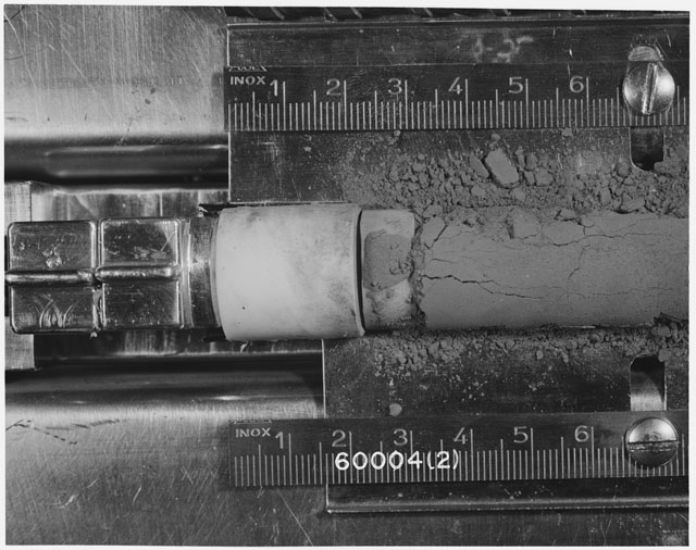 Black and white photograph of Apollo 16 Sample(s) 60004; 2 of 10 Processing photograph displaying Core Tube at 0-7.5 cm depth.