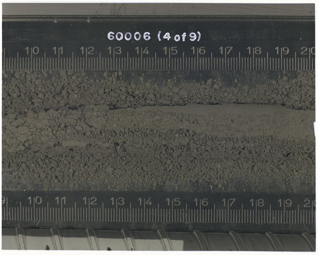 Color photograph of Apollo 16 Sample(s) 60006; 4 OF 9 Processing photograph displaying Core Tube at 9-19.5 cm depth.