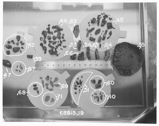 Black and white photograph of Apollo 16 Sample(s) 68815,19,40,42,44,45,47,35,51,53-55,60,63-71; Processing photograph displaying chip, fragments and fines group.
