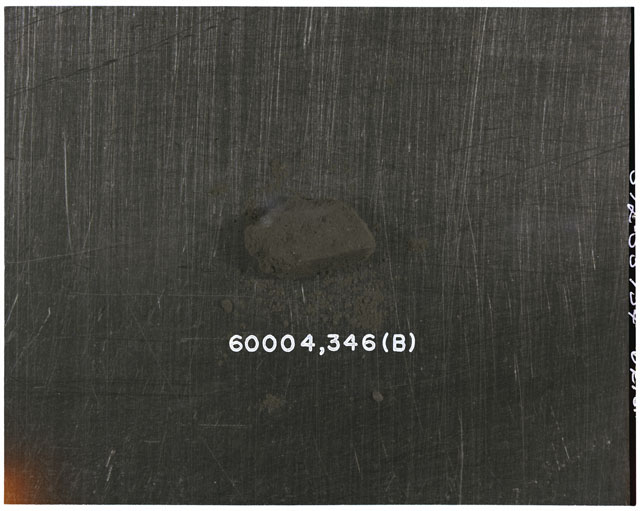 Color photograph of Apollo 16 Core Sample 60004,346; Processing photograph displaying >1 MM Core Fines (B).