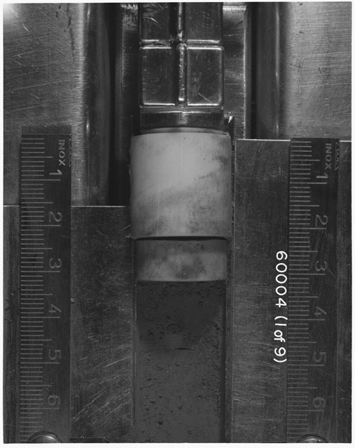 Black and white photograph of Apollo 16 Sample(s) 60004; 1 of 9 Processing photograph displaying Core Tube at 0-7 cm depth.