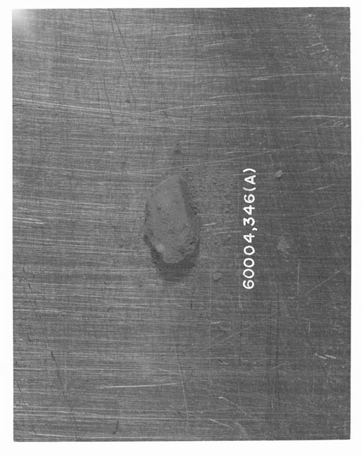 Black and white photograph of Apollo 16 Core Sample 60004,346; Processing photograph displaying >1 MM Core Fines (A).