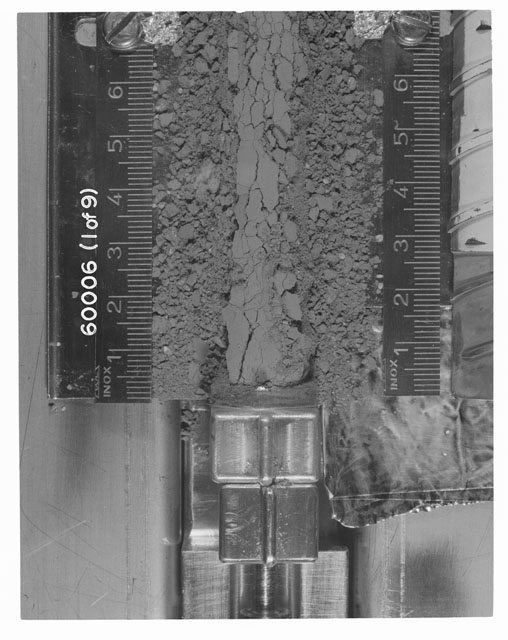 Black and white photograph of Apollo 16 Sample(s) 60006; 1 OF 9 Processing photograph displaying Core Tube at 0-7 cm depth.