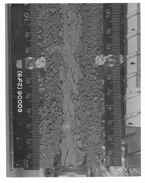 Black and white photograph of Apollo 16 Sample(s) 60006; 2 OF 9 Processing photograph displaying Core Tube at 0-10.5 cm depth.