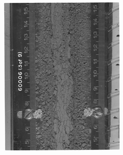 Black and white photograph of Apollo 16 Sample(s) 60006; 3 OF 9 Processing photograph displaying Core Tube at 4.5-15 cm depth.