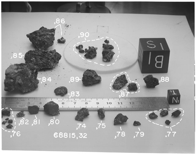 Black and white photograph of Apollo 16 Sample(s) 68815,32,74-90; Processing photograph displaying group with an orientation of S,B.