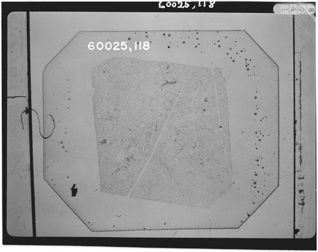 Black and white photograph of Apollo 16 Sample(s) 60025,118; Thin Section photograph using transmitted light.