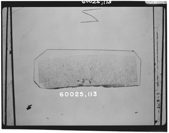 Black and white photograph of Apollo 16 Sample(s) 60025,113; Thin Section photograph using transmitted light.