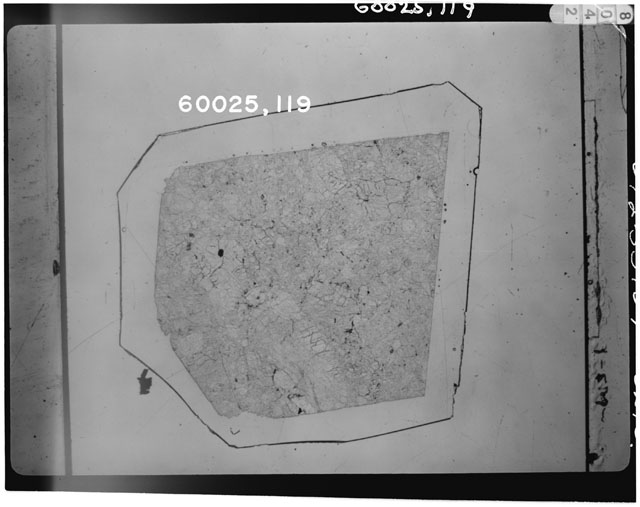 Black and white photograph of Apollo 16 Sample(s) 60025,119; Thin Section photograph using transmitted light.