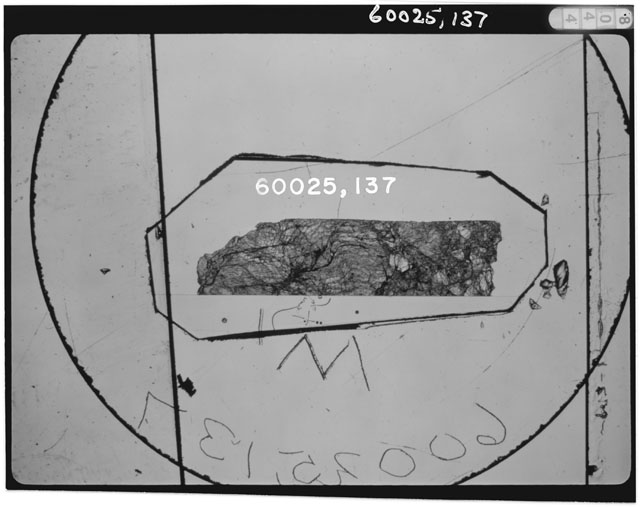 Black and white photograph of Apollo 16 Sample(s) 60025,137; Thin Section photograph using transmitted light.