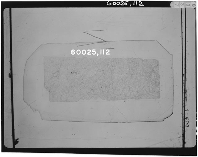 Black and white photograph of Apollo 16 Sample(s) 60025,133; Thin Section photograph using transmitted light.