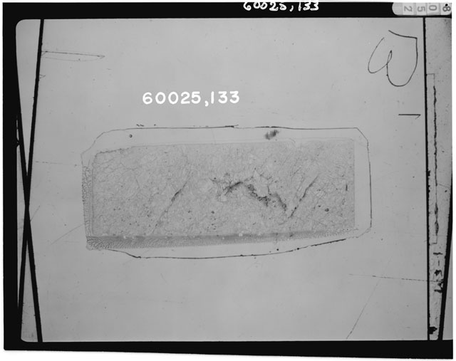 Black and white photograph of Apollo 16 Sample(s) 60025,112; Thin Section photograph using transmitted light.