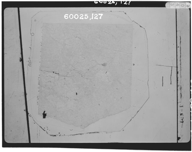 Black and white photograph of Apollo 16 Sample(s) 60025,127; Thin Section photograph using transmitted light.