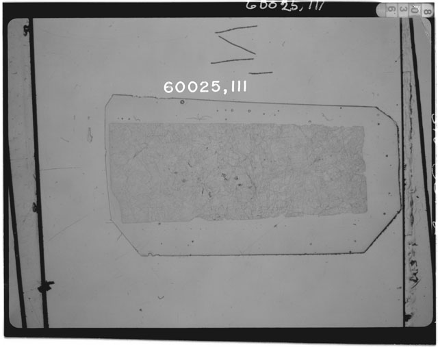 Black and white photograph of Apollo 16 Sample(s) 60025,122; Thin Section photograph using transmitted light.