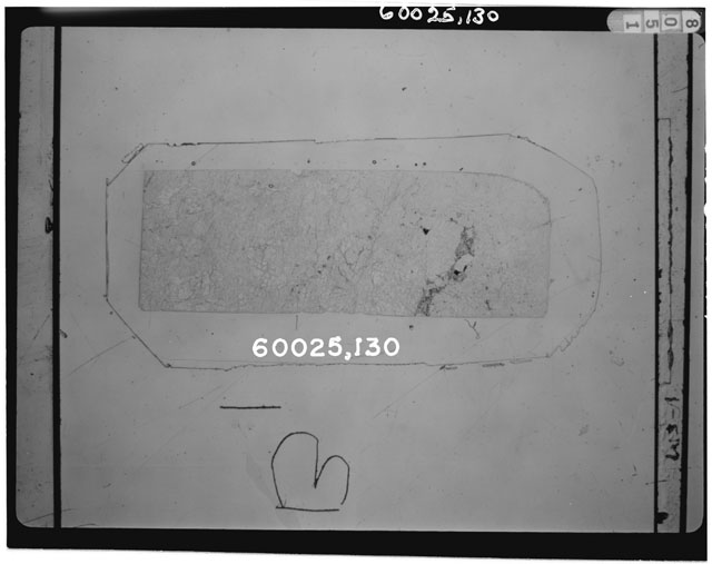 Black and white photograph of Apollo 16 Sample(s) 60025,130; Thin Section photograph using transmitted light.