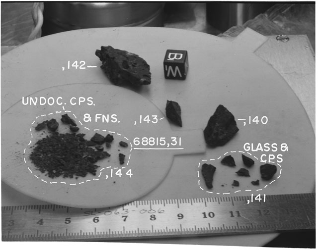 Black and white photograph of Apollo 16 Sample(s) 68815,31,140-144; Processing photograph displaying chips, fragments and fines with an orientation of B,W.