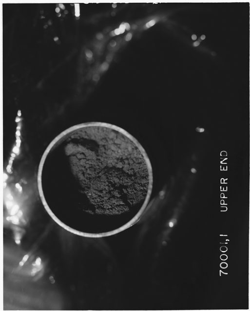 Black and white photograph of Apollo 17 Sample(s) 70001,1; Processing photograph displaying upper end of Core.