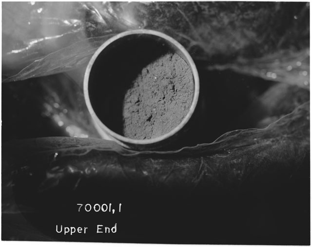 Black and white photograph of Apollo 17 Sample(s) 70001,1; Processing photograph displaying upper end of Core.