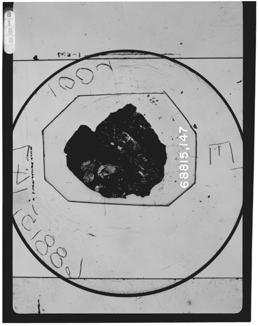 Black and white photograph of Apollo 16 Sample(s) 68815,147; Thin Section photograph using transmitted light.