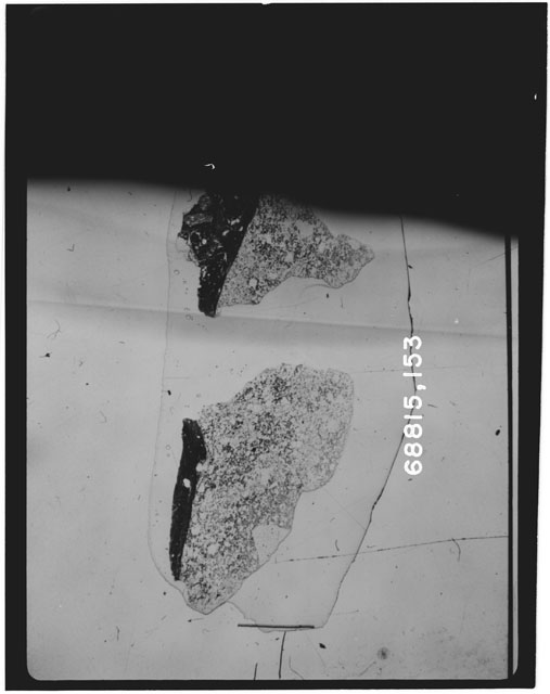 Black and white photograph of Apollo 16 Sample(s) 68815,153; Thin Section photograph using transmitted light.