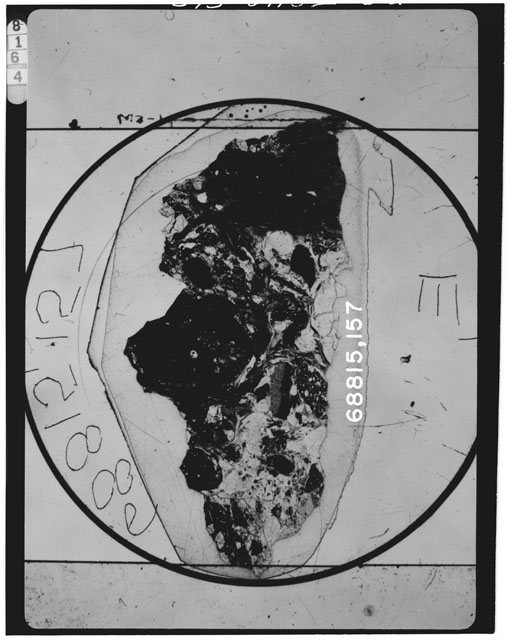 Black and white photograph of Apollo 16 Sample(s) 68815,157; Thin Section photograph using transmitted light.