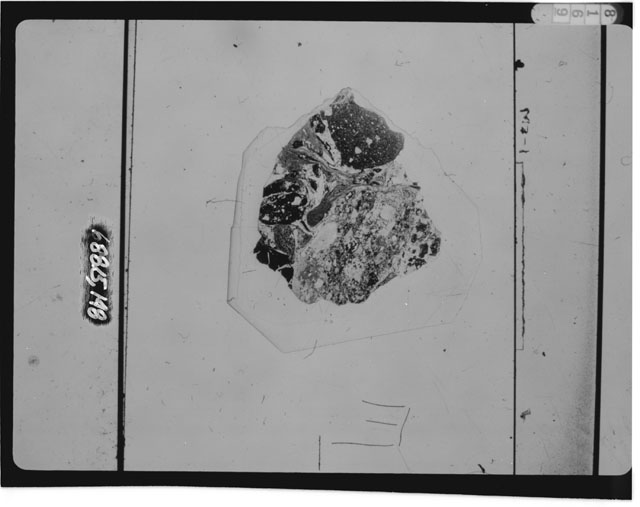 Black and white photograph of Apollo 16 Sample(s) 68815,148; Thin Section photograph using transmitted light.